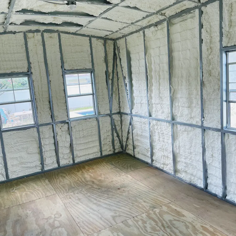 Closed-cell spray foam insulation applied to wall cavities in a residential project in Dundalk